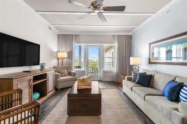 living room with dark wood-type flooring and ceiling fan