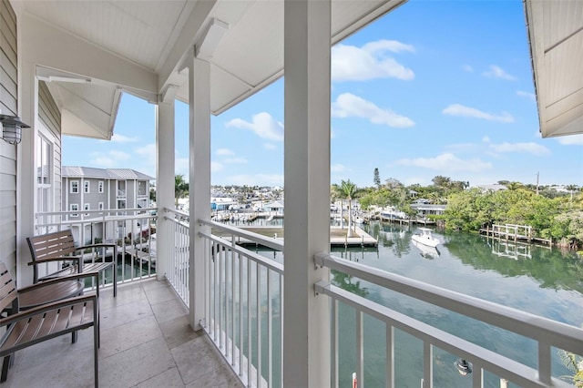 balcony featuring a water view