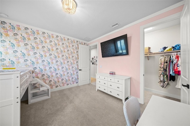 bedroom featuring light colored carpet and ornamental molding