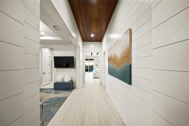 hallway featuring wooden ceiling