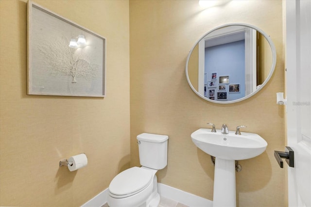 bathroom featuring toilet