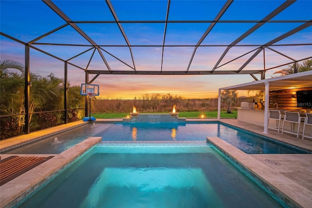 view of pool featuring a bar, a lanai, a patio, and an in ground hot tub