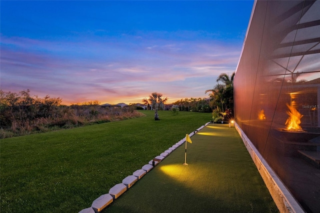 view of yard at dusk