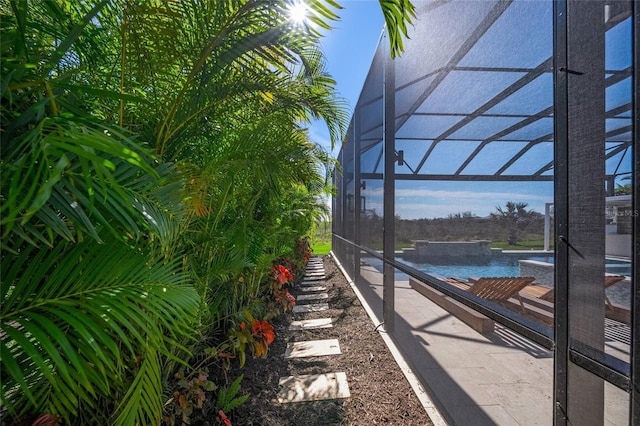 view of yard featuring a lanai