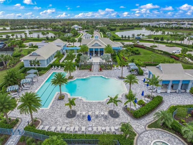 birds eye view of property with a water view