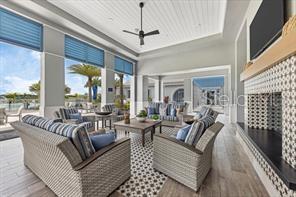 interior space with an outdoor living space and ceiling fan