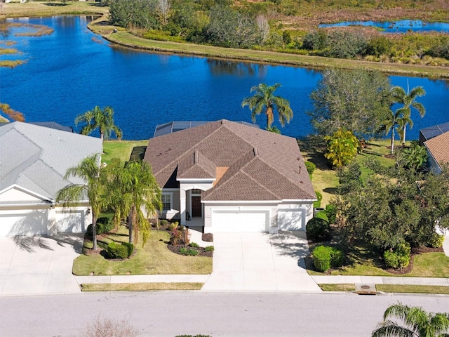 birds eye view of property with a water view