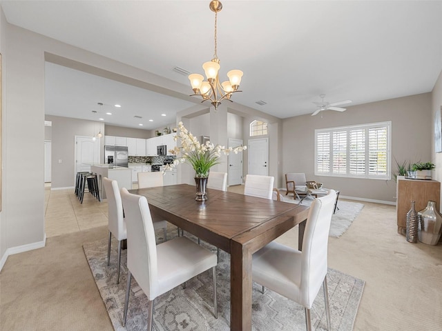 carpeted dining space featuring an inviting chandelier