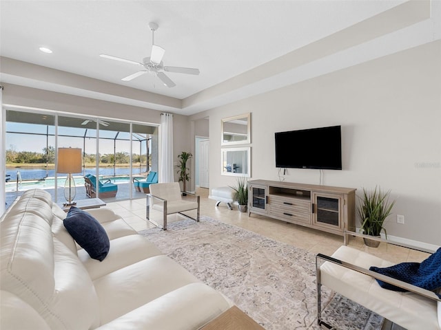 tiled living room with ceiling fan