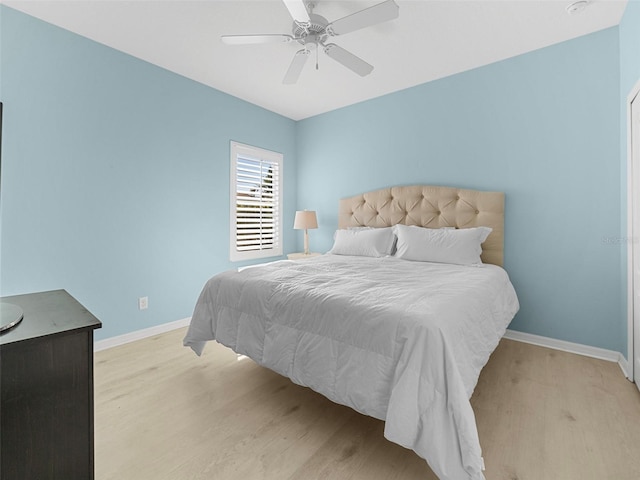 bedroom featuring ceiling fan and light hardwood / wood-style flooring