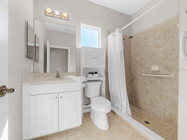 bathroom featuring vanity, tile patterned flooring, a shower with curtain, and toilet