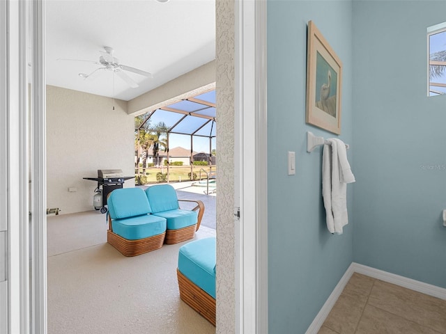 view of patio with a grill, a lanai, and ceiling fan