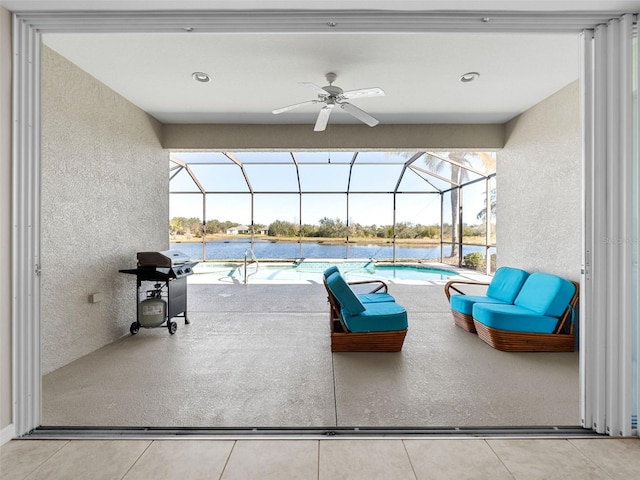 view of patio / terrace featuring a water view, outdoor lounge area, grilling area, and glass enclosure