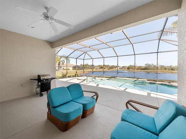 view of patio / terrace featuring a grill, a lanai, ceiling fan, and a water view