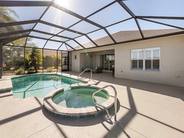 view of swimming pool featuring a lanai, a patio area, and an in ground hot tub