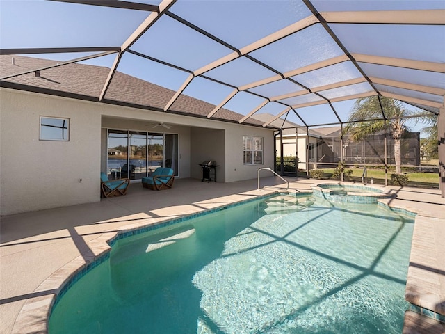 view of pool featuring grilling area, an in ground hot tub, glass enclosure, and a patio area