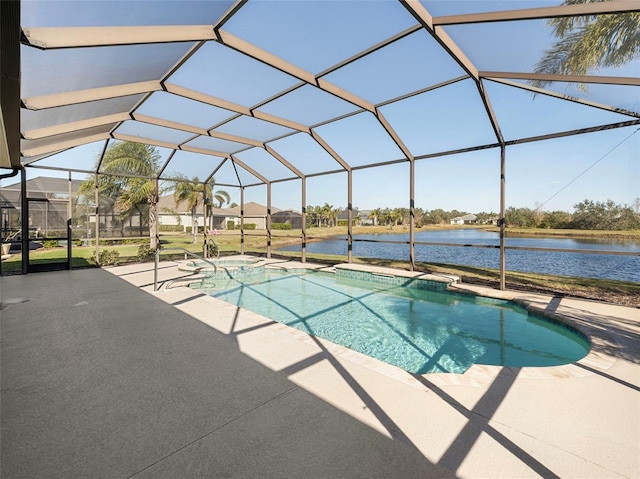 view of swimming pool with a water view, glass enclosure, and a patio area