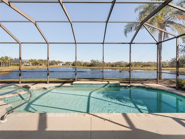 view of pool featuring a lanai, a hot tub, a patio, and a water view