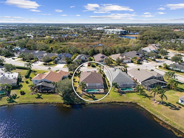 birds eye view of property with a water view