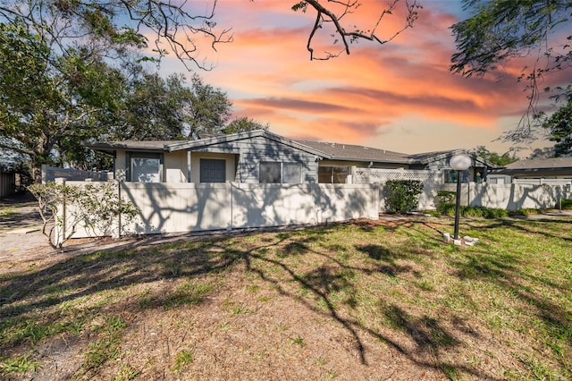 view of front of house with a lawn