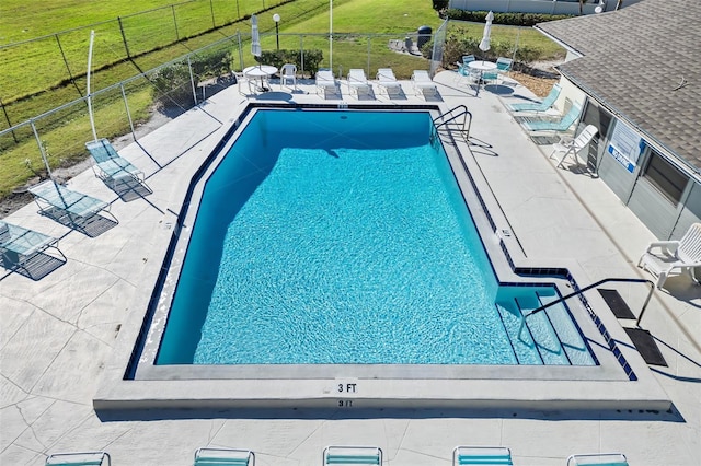 view of pool featuring a patio