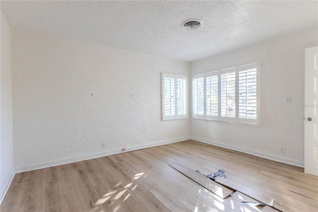 unfurnished room featuring light wood-type flooring