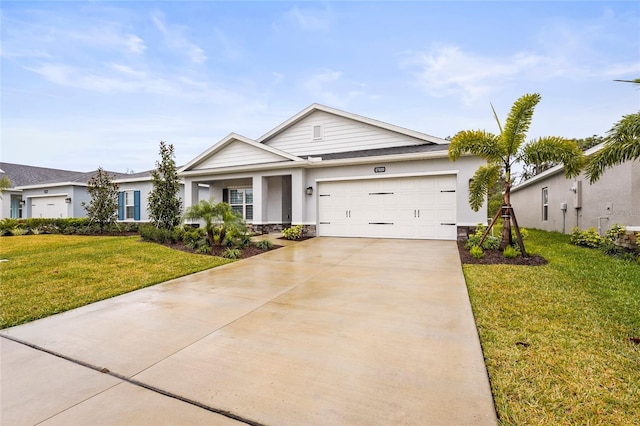 view of front of property featuring a garage and a front lawn