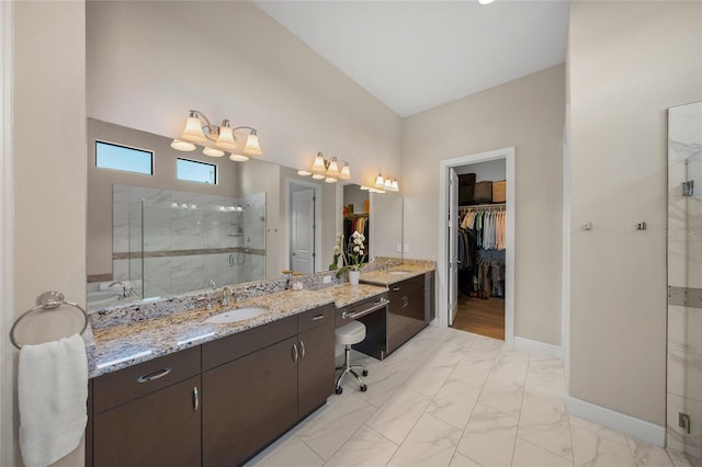 bathroom featuring vanity and an enclosed shower