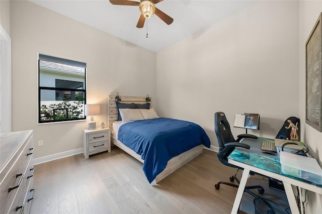 bedroom featuring ceiling fan and light wood-type flooring