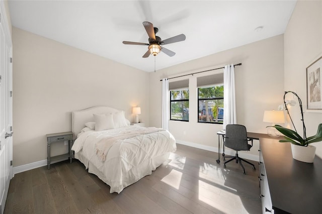 bedroom with ceiling fan and dark hardwood / wood-style flooring