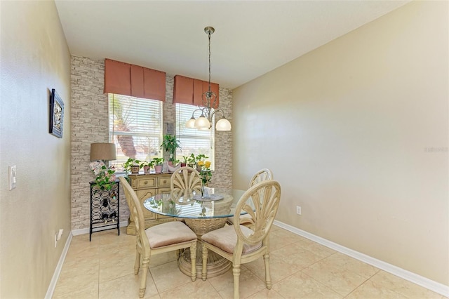 dining room with light tile patterned floors and baseboards