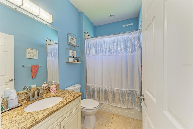 full bathroom featuring vanity, shower / tub combo with curtain, tile patterned floors, and toilet