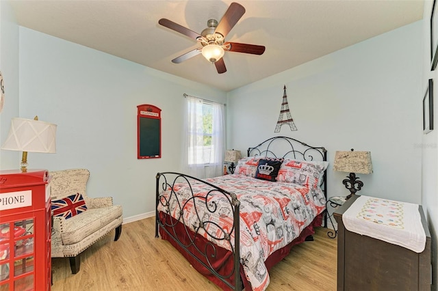 bedroom featuring light hardwood / wood-style floors and ceiling fan