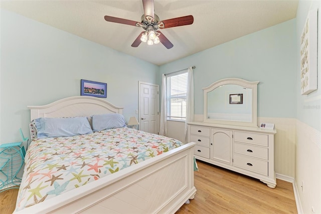 bedroom featuring ceiling fan and light hardwood / wood-style flooring