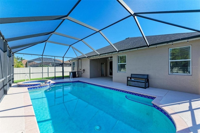 view of swimming pool featuring a patio, fence, a pool with connected hot tub, and a lanai