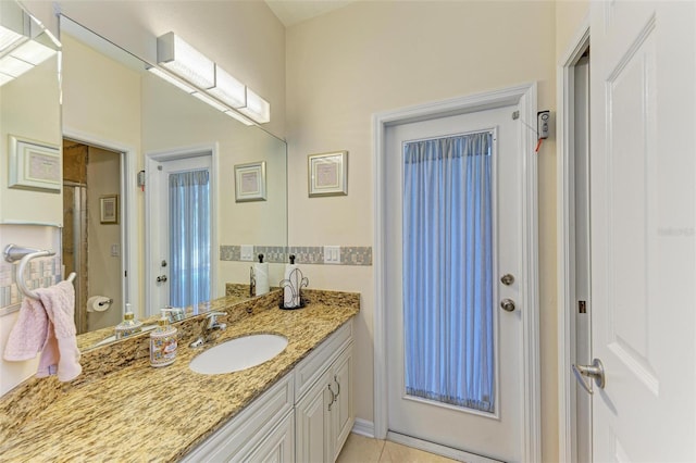 full bathroom with tile patterned flooring and vanity