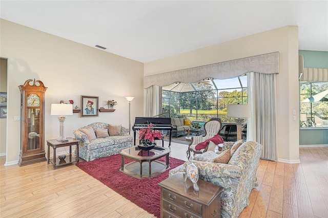 living room featuring light hardwood / wood-style flooring and plenty of natural light