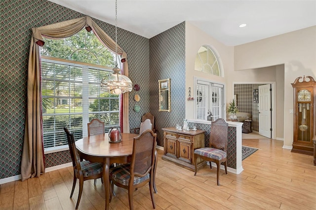 dining area featuring french doors and light hardwood / wood-style flooring