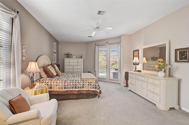 bedroom featuring light carpet, access to outside, and ceiling fan