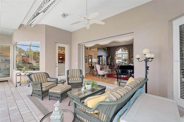 view of patio with outdoor lounge area and ceiling fan