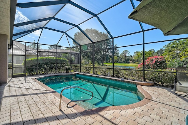 view of swimming pool featuring a water view, a patio, and a lanai