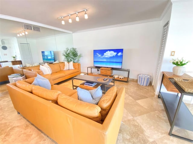 living room featuring track lighting and ornamental molding