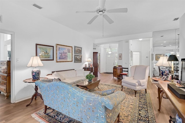 living room with hardwood / wood-style flooring and ceiling fan