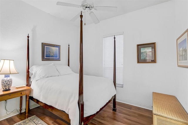 bedroom with ceiling fan and dark hardwood / wood-style flooring