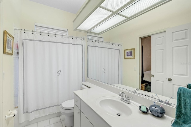 bathroom with tile patterned floors, vanity, and toilet