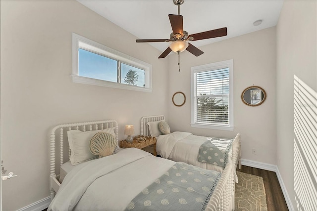 bedroom featuring dark hardwood / wood-style flooring and ceiling fan