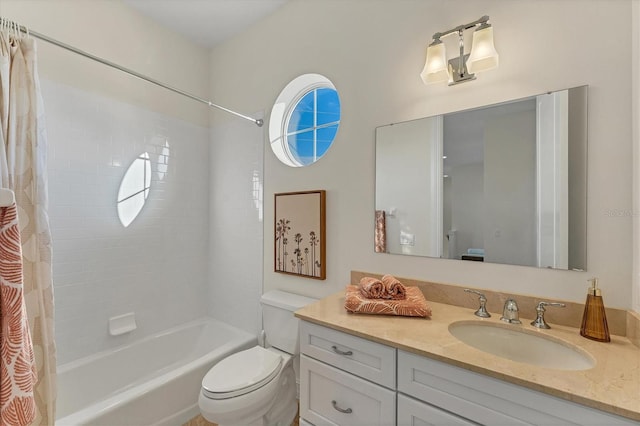 full bathroom featuring vanity, shower / bath combination with curtain, and toilet