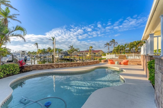 view of swimming pool featuring a water view