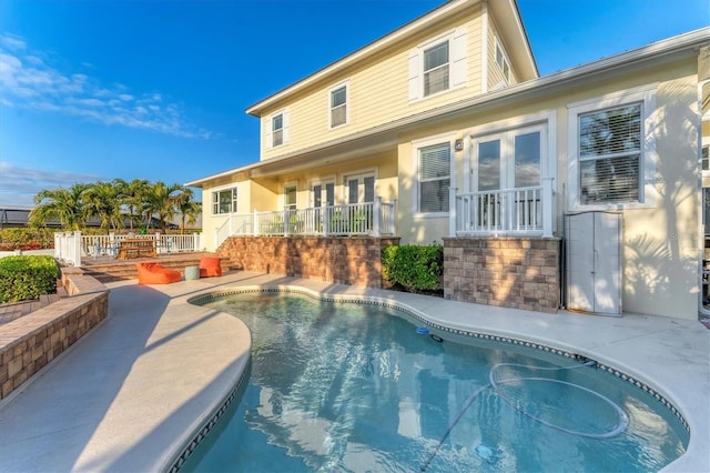 back of house with a patio