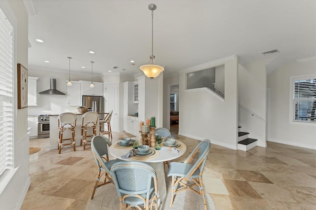 dining room featuring ornamental molding